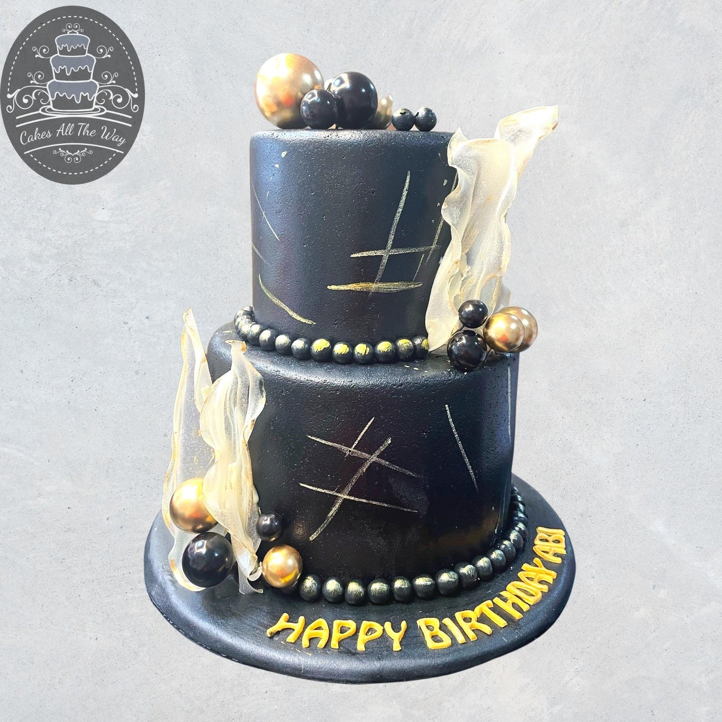 2-Tier Black and Gold Theme Cake