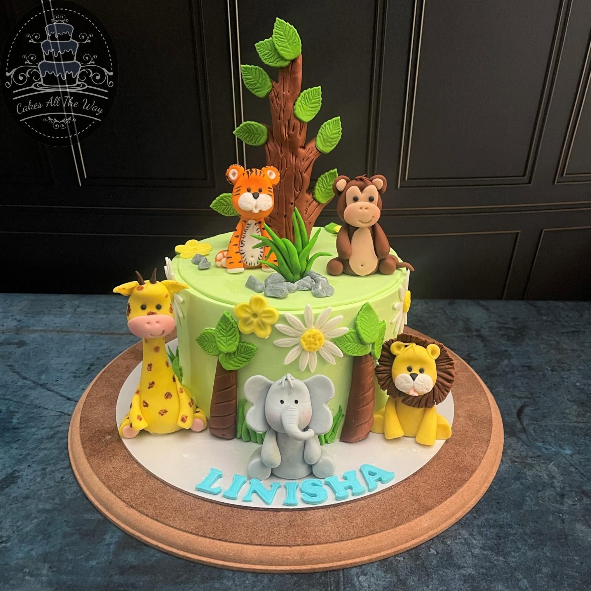 I made this safari themed cake at work today! I hate fondant but I'm happy  with how the lil lion turned out he's so cute 🥰 : r/cakedecorating